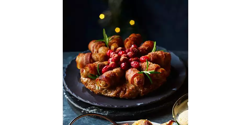 Extra Special Brown Butter & Spiced Dark Rum Stuffing Wreath with Brûléed Pigs in Blankets, £8/serves 10